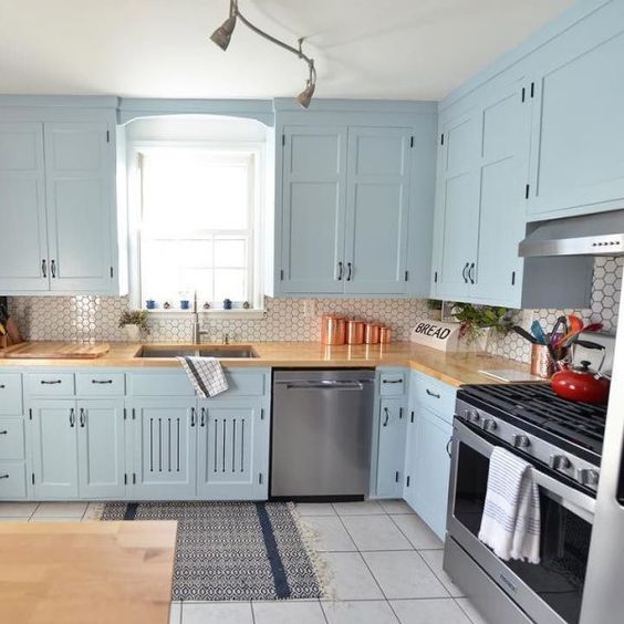 Sherwin-Williams Faded Flaxflower Painted Cabinets With A Butcher Block Countertop And Tile Backsplash