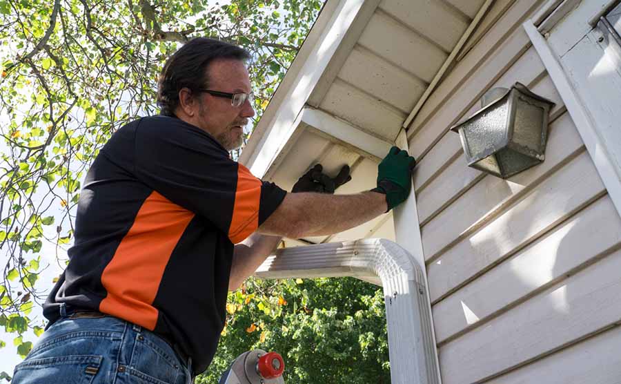 Man Installing Vinyl Siding Lg