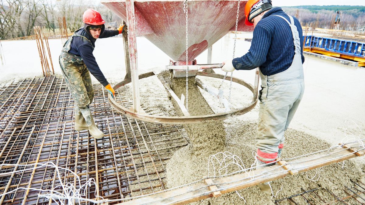 Construction Workers Pouring Concrete Foundation